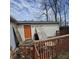 Damaged deck with orange door at 1704 E Kirk St, Muncie, IN 47303