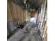 Room restoration incomplete with exposed insulation and flooring issues at 1704 E Kirk St, Muncie, IN 47303