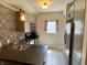 Modern kitchen with stainless steel appliances, gray cabinetry, and stylish backsplash at 1749 E 52Nd St, Indianapolis, IN 46205
