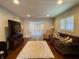 Cozy living room with hardwood floors, a large rug, and comfortable seating at 1749 E 52Nd St, Indianapolis, IN 46205