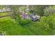 Aerial view of the beautiful home surrounded by lush greenery and blue skies at 1917 W 58Th St, Indianapolis, IN 46228