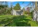 Exterior view of a well maintained home with spacious backyard and plenty of seating at 1917 W 58Th St, Indianapolis, IN 46228