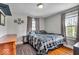 Simple bedroom with hardwood floors, neutral walls, and lots of natural light at 1917 W 58Th St, Indianapolis, IN 46228