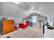 Bedroom with light blue walls, gray carpet, toys, and a window with decorative banner above at 1917 W 58Th St, Indianapolis, IN 46228