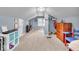Spacious carpeted room with light blue walls, walk in closet, and a small bookcase at 1917 W 58Th St, Indianapolis, IN 46228