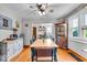 Bright dining room with hardwood floors, built-in cabinet, and connecting spaces at 1917 W 58Th St, Indianapolis, IN 46228