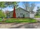 Charming home with a red brick chimney, well-maintained lawn, and an attached garage at 1917 W 58Th St, Indianapolis, IN 46228