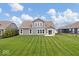 Spacious backyard showcasing a well-manicured lawn and the home's rear elevation at 19283 Donelson Ln, Westfield, IN 46062