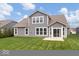 Expansive backyard featuring lush green lawn and a view of the home's exterior at 19283 Donelson Ln, Westfield, IN 46062