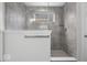 Modern bathroom featuring gray tile shower, glass partition and chrome fixtures at 19283 Donelson Ln, Westfield, IN 46062