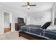 Comfortable bedroom with a ceiling fan, large windows, and neutral carpet at 19283 Donelson Ln, Westfield, IN 46062