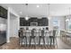 Modern kitchen featuring stainless steel appliances, a breakfast bar, and pendant lighting at 19283 Donelson Ln, Westfield, IN 46062
