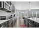 Gourmet kitchen with modern appliances, custom cabinetry, and a scenic view from the windows at 19283 Donelson Ln, Westfield, IN 46062