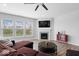 Comfortable living room showcasing a fireplace, ample natural light, and a modern design at 19283 Donelson Ln, Westfield, IN 46062