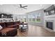 Bright and airy living room featuring a fireplace, large windows, and an open floor plan at 19283 Donelson Ln, Westfield, IN 46062