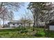 Lush backyard with vibrant flower beds and a charming view of the house and shed at 2001 S I St, Elwood, IN 46036