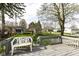 Spacious backyard with a wooden deck, green grass and a white plastic chair at 2001 S I St, Elwood, IN 46036