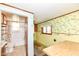 Bathroom with tub and bright wallpaper at 2001 S I St, Elwood, IN 46036