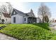 Two-story home with gray siding, inviting porch, and grassy front yard, situated on a sunny lot at 2001 S I St, Elwood, IN 46036