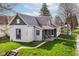 Charming home with a well-maintained lawn and a cozy front porch in a quaint neighborhood setting at 2001 S I St, Elwood, IN 46036