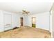 Living room with outdated carpet, neutral walls, and classic trim, offering a blank canvas for new owners at 2001 S I St, Elwood, IN 46036