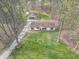 Aerial view featuring the home with mature trees, landscaping, and garage at 2088 Brandywine Ln, Martinsville, IN 46151