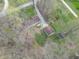 Aerial view of property featuring home, garage, outbuildings, and driveway at 2088 Brandywine Ln, Martinsville, IN 46151