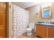 Bathroom featuring a shower, toilet, vanity, and seashell-themed shower curtain at 2088 Brandywine Ln, Martinsville, IN 46151