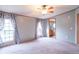 Bright bedroom featuring a ceiling fan and natural light, perfect for relaxation and rest at 2088 Brandywine Ln, Martinsville, IN 46151