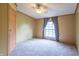 Inviting bedroom with a ceiling fan and window showcasing a view, promoting a cozy ambiance at 2088 Brandywine Ln, Martinsville, IN 46151