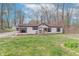 Inviting home featuring a lush front yard and gravel driveway at 2088 Brandywine Ln, Martinsville, IN 46151