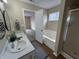 A bathroom featuring double sinks, soaking tub, and enclosed shower at 2344 Orchard Creek Dr, Columbus, IN 47201