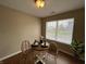 Bright dining area with wood floors, a view of the outdoors, and comfortable seating for two at 2344 Orchard Creek Dr, Columbus, IN 47201