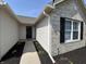 Front entrance featuring a walkway and tidy landscaping with a brick and vinyl exterior at 2344 Orchard Creek Dr, Columbus, IN 47201