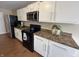 Well-equipped kitchen with stainless steel appliances and ample cabinet space at 2344 Orchard Creek Dr, Columbus, IN 47201