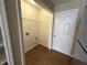 A conveniently placed laundry room features essential connections and storage solutions at 2344 Orchard Creek Dr, Columbus, IN 47201