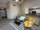 Inviting living room with vaulted ceilings and view into kitchen, decorated with modern furnishings at 2344 Orchard Creek Dr, Columbus, IN 47201