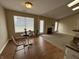 An open floor plan showcases a cozy dining nook and a fireplace in the living area at 2344 Orchard Creek Dr, Columbus, IN 47201