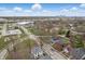 Aerial view of a residential neighborhood with tree-lined streets and a distant city skyline at 2352 Stuart St, Indianapolis, IN 46218