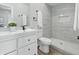 Stylish bathroom with tiled walk-in shower, contemporary vanity, and ample lighting at 2352 Stuart St, Indianapolis, IN 46218