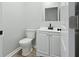 Compact bathroom with a modern vanity, toilet, and minimalist design at 2352 Stuart St, Indianapolis, IN 46218