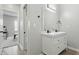 Clean bathroom features a double sink vanity, large mirror, and modern fixtures at 2352 Stuart St, Indianapolis, IN 46218