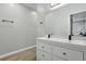 Bright bathroom features a double sink vanity, large mirror, and modern fixtures at 2352 Stuart St, Indianapolis, IN 46218