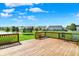 A well-maintained wooden deck offers a charming outdoor living space with backyard views at 241 Green Meadow Dr, Indianapolis, IN 46229