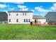 Expansive backyard with a wooden deck, ideal for outdoor entertaining and relaxation at 241 Green Meadow Dr, Indianapolis, IN 46229