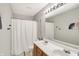 Bathroom features a double sink vanity and a shower at 241 Green Meadow Dr, Indianapolis, IN 46229