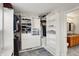 Walk-in closet features custom shelving, drawers and organization accessories at 241 Green Meadow Dr, Indianapolis, IN 46229