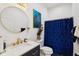 Charming bathroom with modern fixtures, navy vanity, and gold accents at 2428 N Gale St, Indianapolis, IN 46218
