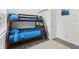 Bright bedroom with dark wood bunk beds and light grey wood flooring at 2428 N Gale St, Indianapolis, IN 46218