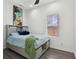 This bedroom features a stylish platform bed with storage and modern decor, offering a cozy and functional space at 2428 N Gale St, Indianapolis, IN 46218